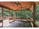 Relaxing screened deck with wooden ceiling, fan, and scenic views at 5240 Arrie Way, Atlanta, GA 30360