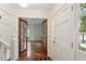 Inviting entryway with hardwood floors and elegant french doors leading into the living room at 5240 Arrie Way, Atlanta, GA 30360