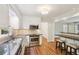 Kitchen with stainless steel appliances, granite countertops, breakfast bar, and hardwood flooring at 5240 Arrie Way, Atlanta, GA 30360