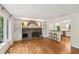 Bright living room with a brick fireplace, built-in bookshelves, and hardwood floors at 5240 Arrie Way, Atlanta, GA 30360