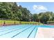 A refreshing community swimming pool surrounded by lounge chairs and greenery at 5240 Arrie Way, Atlanta, GA 30360