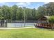 Community tennis court with shaded gazebo and lush green surroundings at 5240 Arrie Way, Atlanta, GA 30360