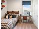 Stylish bedroom decorated with sports theme and ample natural light from a large window at 102 Sheryl Way, Loganville, GA 30052