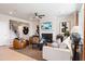Inviting living room featuring a fireplace, ceiling fan, and stylish decor at 102 Sheryl Way, Loganville, GA 30052
