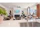 Bright and airy living room featuring a fireplace, stylish decor, and seamless flow from the open kitchen at 102 Sheryl Way, Loganville, GA 30052