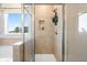 Modern shower stall featuring tile surround, recessed lighting and glass door at 102 Sheryl Way, Loganville, GA 30052