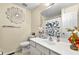 Bright bathroom with a decorative mirror, single vanity, and butterfly-themed shower curtain at 3485 Palisade Lake Dr, Duluth, GA 30096