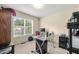 Bedroom featuring a large window with blinds, desk with computer, and storage at 3485 Palisade Lake Dr, Duluth, GA 30096