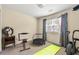 Bright bedroom featuring exercise equipment, neutral decor, and natural light at 3485 Palisade Lake Dr, Duluth, GA 30096