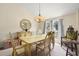 Bright dining room with an elegant table, stylish chairs, and a decorative chandelier at 3485 Palisade Lake Dr, Duluth, GA 30096