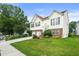 Attractive two-story home with a lush green lawn, mature trees, and a double garage at 3485 Palisade Lake Dr, Duluth, GA 30096
