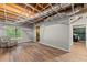 Partially finished basement with wood-look flooring, a window, and ample potential for customization at 5510 Pilgrim Point Ext, Cumming, GA 30041