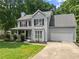 Charming two-story home with a covered porch and a well-manicured lawn, perfect curb appeal at 5510 Pilgrim Point Ext, Cumming, GA 30041