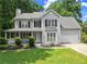 Charming two-story home with a covered porch and a well-manicured lawn, perfect curb appeal at 5510 Pilgrim Point Ext, Cumming, GA 30041