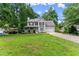 Charming two-story home with a well-manicured lawn and inviting curb appeal at 5510 Pilgrim Point Ext, Cumming, GA 30041