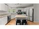 Well-equipped kitchen features stainless steel appliances, granite counters, and a convenient center island at 5510 Pilgrim Point Ext, Cumming, GA 30041