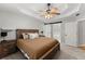 Primary bedroom with ceiling fan, carpet floors, sliding door and bedside tables at 5510 Pilgrim Point Ext, Cumming, GA 30041