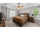 Primary bedroom featuring a ceiling fan, carpet floors and a window for plenty of light at 5510 Pilgrim Point Ext, Cumming, GA 30041