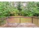View of densely wooded backyard from wood deck at 2139 Jonathan Ave, Lithonia, GA 30058