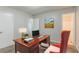 Cozy bedroom featuring a wood desk with a laptop and a vivid painting on the wall at 2139 Jonathan Ave, Lithonia, GA 30058