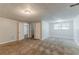 Spacious bedroom with neutral carpet, complemented by natural light from the window at 2139 Jonathan Ave, Lithonia, GA 30058