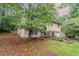 Side view of a well-maintained home with a lush yard and a charming front entrance at 2139 Jonathan Ave, Lithonia, GA 30058