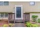 Close-up of the front door with brown railings and a walkway leading to the entrance at 2139 Jonathan Ave, Lithonia, GA 30058