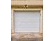 Garage door with paneled design and overhead lighting, providing secure and convenient parking at 2139 Jonathan Ave, Lithonia, GA 30058