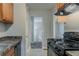 A cozy kitchen with black appliances, light countertops, and warm wood cabinetry at 2139 Jonathan Ave, Lithonia, GA 30058