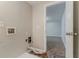 Unfinished laundry area with washer-dryer hookups near an open door at 2139 Jonathan Ave, Lithonia, GA 30058