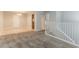 Open-concept living room with a view of the dining area and stairs featuring neutral decor at 2139 Jonathan Ave, Lithonia, GA 30058