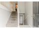 A carpeted staircase leading upstairs with white railings and a light gray wall at 2139 Jonathan Ave, Lithonia, GA 30058