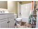 Bathroom with tiled floor and shower-tub with shower curtain at 2650 Batavia St, East Point, GA 30344