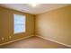 Bedroom featuring neutral paint, carpeted floor and a window for natural light at 2650 Batavia St, East Point, GA 30344