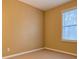 Cozy bedroom with neutral carpet, warm paint color, and a bright window at 2650 Batavia St, East Point, GA 30344