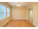 Bright dining room featuring hardwood floors and natural light from two windows at 2650 Batavia St, East Point, GA 30344