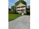 Charming two-story home featuring double porches, a concrete drive, and a red front door at 2650 Batavia St, East Point, GA 30344