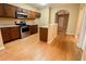 Modern kitchen with stainless appliances, wood cabinets and granite countertops at 2650 Batavia St, East Point, GA 30344