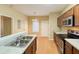 Modern kitchen featuring stainless appliances, granite countertops and wood cabinets at 2650 Batavia St, East Point, GA 30344