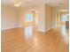 Bright living room featuring hardwood floors, neutral paint, and arched doorways at 2650 Batavia St, East Point, GA 30344
