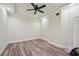 Spacious bedroom with tray ceiling, ceiling fan and wood-look floors at 3850 Stepney Way, Cumming, GA 30041