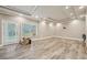 Versatile bonus room with recessed lighting and sliding glass doors leading to the outdoors at 3850 Stepney Way, Cumming, GA 30041