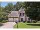Charming two-story home with attached two car garage and well-maintained lawn at 3850 Stepney Way, Cumming, GA 30041