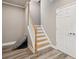Entryway with stairs and vinyl floors, leading to additional storage space behind double doors at 3850 Stepney Way, Cumming, GA 30041