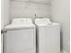 Functional laundry area with a washer and dryer, maximizing space efficiency at 3850 Stepney Way, Cumming, GA 30041