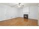 Cozy living room features a fireplace, hardwood floors, and ample natural light at 3850 Stepney Way, Cumming, GA 30041