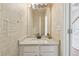 Powder room with decorative wallpaper, and a white vanity at 3850 Stepney Way, Cumming, GA 30041