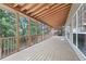 Large screened porch with wood floors and views of the backyard at 3850 Stepney Way, Cumming, GA 30041