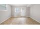 Basement area features neutral walls, flooring, and natural light from two windows at 695 Hiram Sudie Rd, Dallas, GA 30157