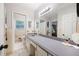 Well-lit bathroom featuring a large mirror and vanity with plenty of counter space at 695 Hiram Sudie Rd, Dallas, GA 30157